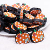 front view of a pile of Fall Pumpkin Silicone Focal Bead Accessory - 27mm x 30mm