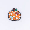 top view of a pile of Fall Pumpkin Silicone Focal Bead Accessory - 27mm x 30mm