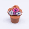 top view of a pile of Flower Bouquet with Brown Pot silicone focal bead