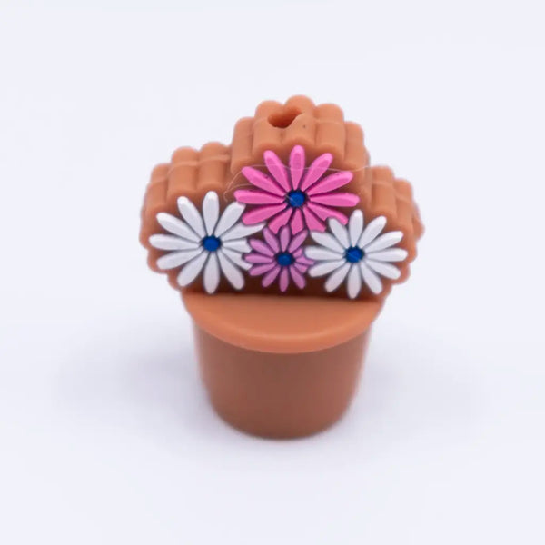 top view of a pile of Flower Bouquet with Brown Pot silicone focal bead