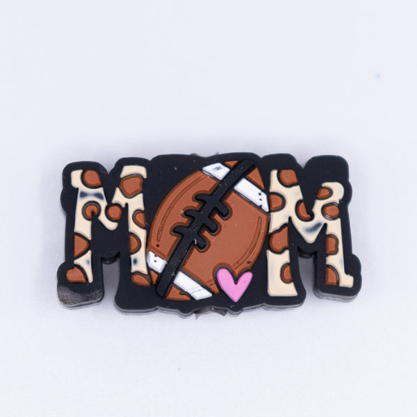 top view of a pile of Football Mom Silicone Focal Bead Accessory