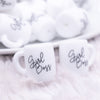 Zoomed view of a pile of Girl Boss Coffee Cup Silicone Focal Bead Accessory