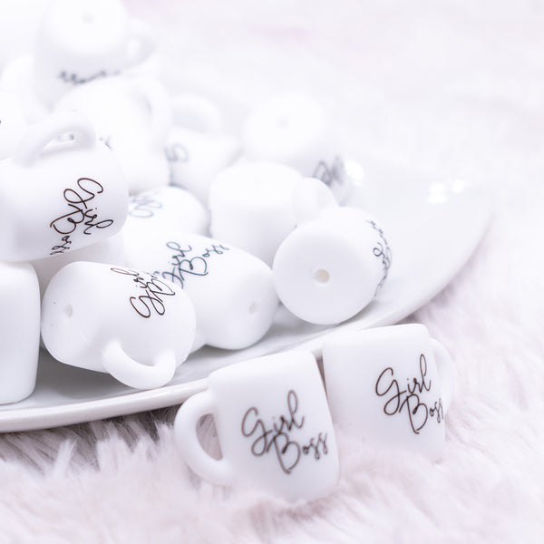 front view of a pile of Girl Boss Coffee Cup Silicone Focal Bead Accessory