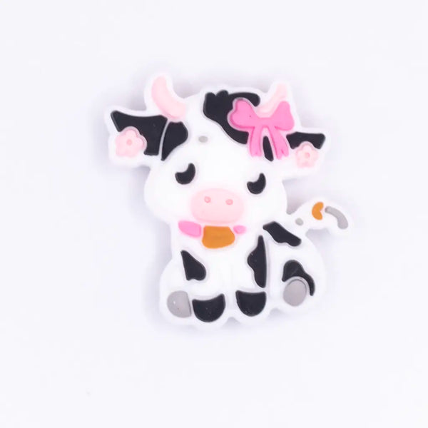 top view of a pile of Girly Cow Silicone Focal Bead Accessory