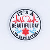top view of a pile of It's A Beautiful Day To Save Lives Silicone Focal Bead Accessory