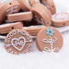 close up  view of a pile of Good Moms Say Bad Words Silicone Focal Bead Accessory