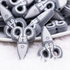 close up view of a pile of Scissors Gray Silicone Focal Bead Accessory