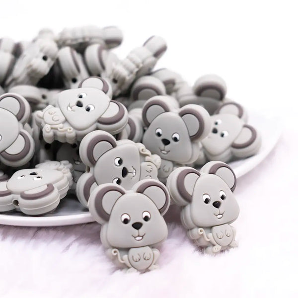 front view of a pile of Gray Mouse Silicone Focal Bead Accessory
