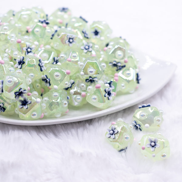 front view of a pile of 16mm Green with Flower luxury acrylic beads