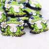 close up view of a pile of Green Frog Silicone Focal Bead Accessory