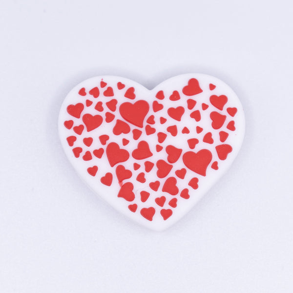 front view of a pile of Heart with Hearts Silicone Focal Bead Accessory