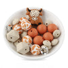 front view of a pile of Highland Cow Silicone Variety Bead Pack- 27 Pieces