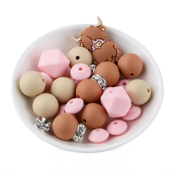 front view of a pile of Highland Cow Silicone Variety Bead Pack- 27 Pieces