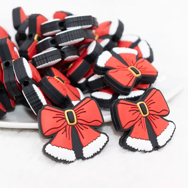 front view of a pile of Christmas Bow Silicone Focal Bead Accessory