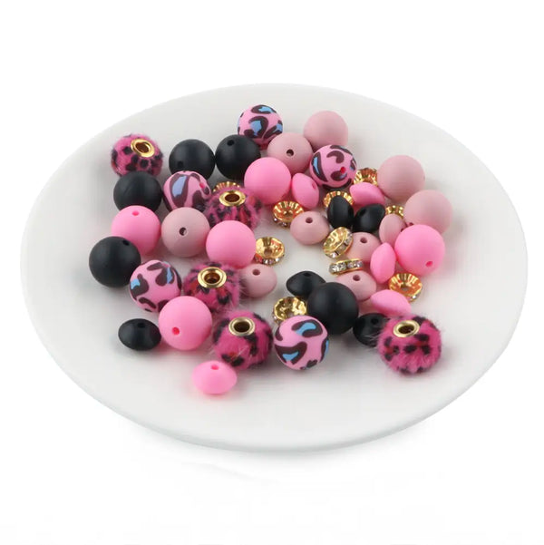 front view of a pile of Hot Pink Animal Print Silicone Variety Bead Pack - 50 Pieces