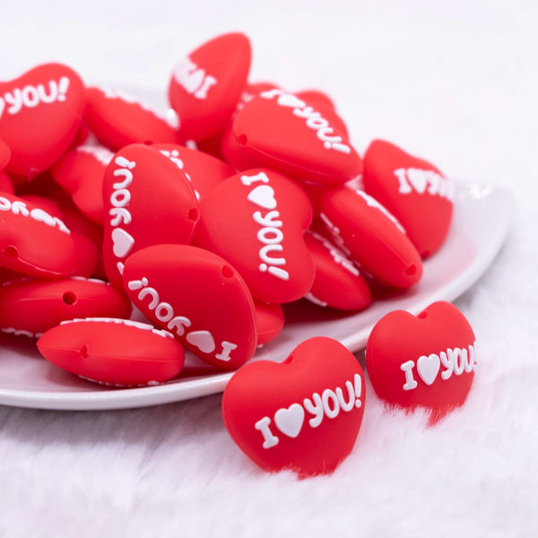 top view of a pile of I Love You Heart Silicone Focal Bead Accessory