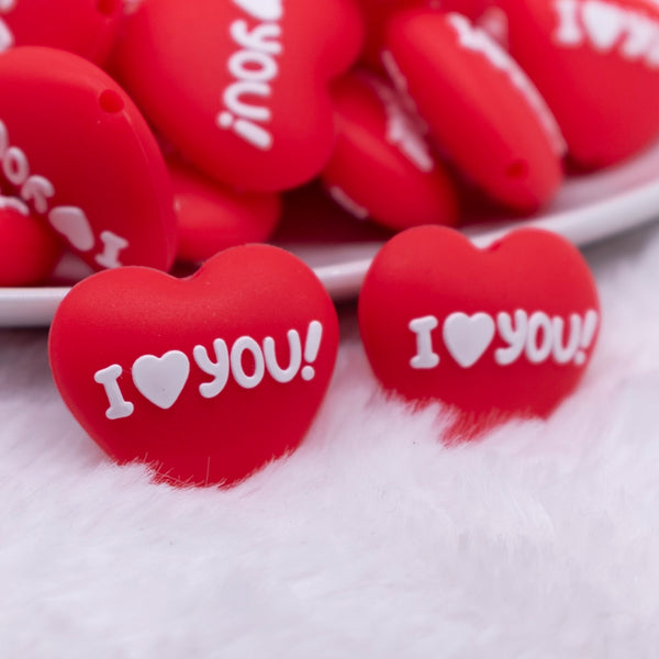 front view of a pile of I Love You Heart Silicone Focal Bead Accessory