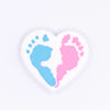 top view of a pile of Infant foot prints Silicone Focal Bead Accessory