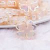 close up view of a pile of 25mm Ivory Clover acrylic bead