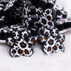 close up view of a pile of Leopard Paw Print Silicone Focal Bead Accessory