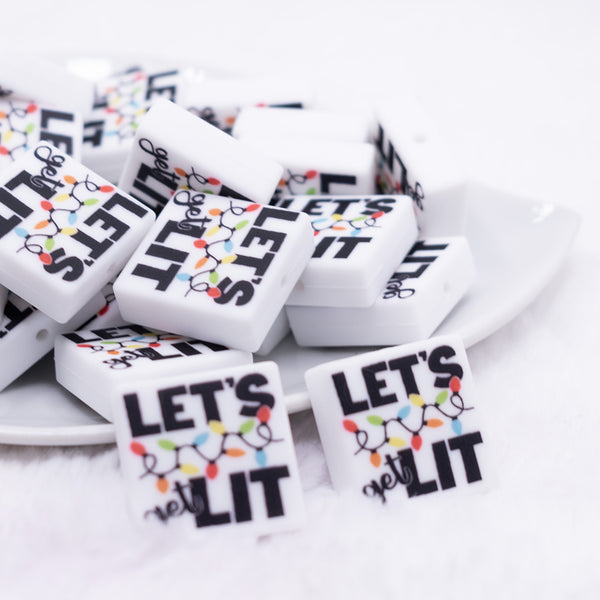 front view of a pile of Let's Get Lit Silicone Focal Bead Accessory