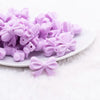 front view of a pile of 25mm Light Purple Bow Knot silicone bead