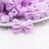 close up view of a pile of 25mm Light Purple Bow Knot silicone bead