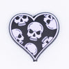 macro view of a pile of Lilac Purple Skull Heart Silicone Focal Bead Accessory