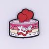 top view of a pile of Love Cake Silicone Focal Bead Accessory