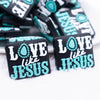 close up view of a pile of Love Like Jesus Silicone Focal Bead Accessory