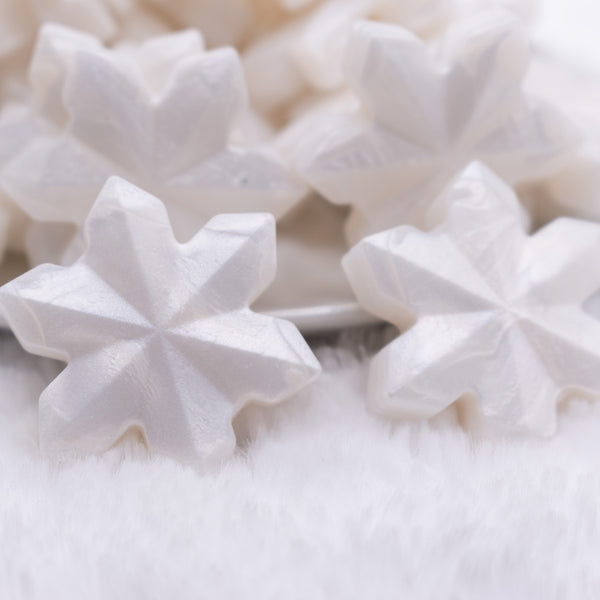 close up view of a Metallic White Snowflake Silicone Focal Bead Accessory