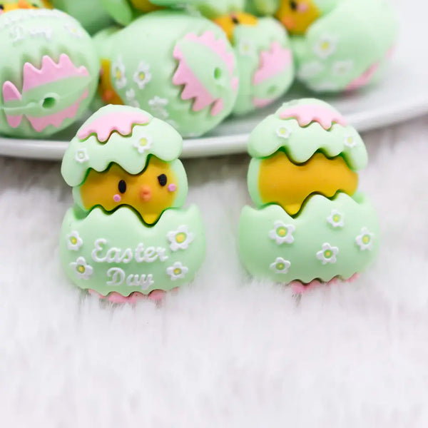 Macro view of a pile of 3D Green Chick Easter Silicone Focal Bead Accessory
