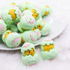 front view of a pile of 3D Green Chick Easter Silicone Focal Bead Accessory