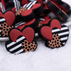 close up view of a pile of Triple Hearts Silicone Focal Bead Accessory