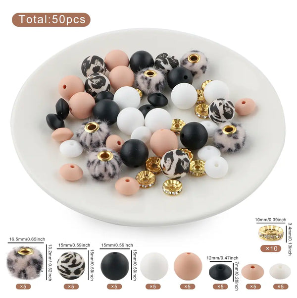 detailed view of a pile of Cream Animal Print Silicone Variety Bead Pack - 50 Pieces