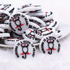 front view of a pile of Nursing Is a Work of Heart Silicone Focal Bead Accessory