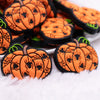 macro view of a pile of Orange Pumpkin Silicone Focal Bead Accessory