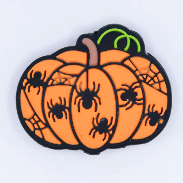 top view of a pile of Orange Pumpkin Silicone Focal Bead Accessory
