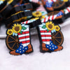 close up view of a pile of Patriotic Boots Silicone Focal Bead Accessory