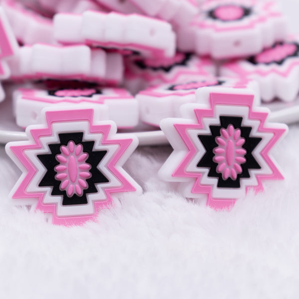 close up view of a pile of Pink Aztec Silicone Focal Bead Accessory