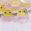 close up view of a pile of 26mm Pink Easter Egg with Chick acrylic bead