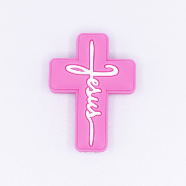 top view of a pile of Pink Cross Silicone Focal Bead Accessory