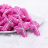 front view of a pile of Pink Cross Silicone Focal Bead Accessory