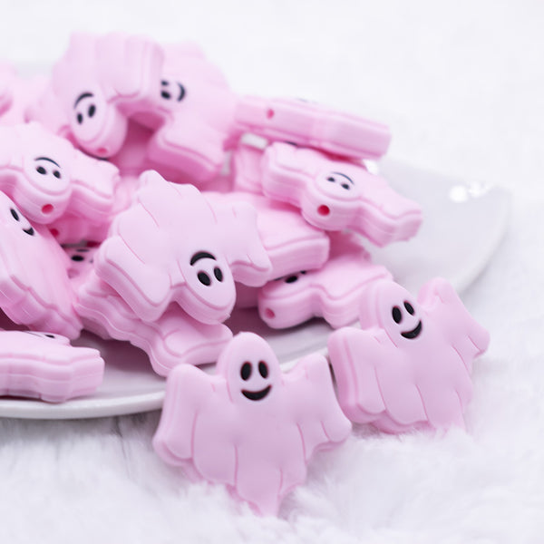 front view of a pile of Pink Ghost Silicone Focal Bead Accessory