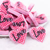 front view of a pile of Pink Love Heart Silicone Focal Bead Accessory