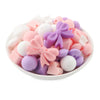 front view of a pile of Bow Silicone Variety Bead Pack with storage case- 34 Pieces