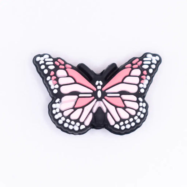 top view of a pile of Pink Butterfly Silicone Focal Bead Accessory