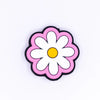 top view of a pile of Pink Daisy Silicone Focal Bead Accessory