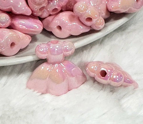 close up view of a pile of Pink Dress Acrylic Focal Bead