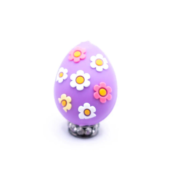 top view of a pile of 3D Purple Egg with Flowers Silicone Focal Bead Accessory